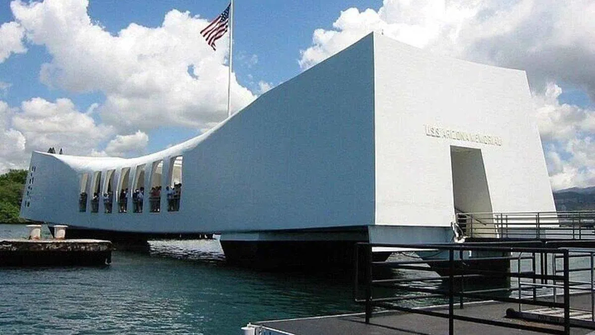 Boat approaching the white USS Arizona Memorial on a Pearl Harbor Honolulu city tour from Waikiki, Oahu, Hawaii